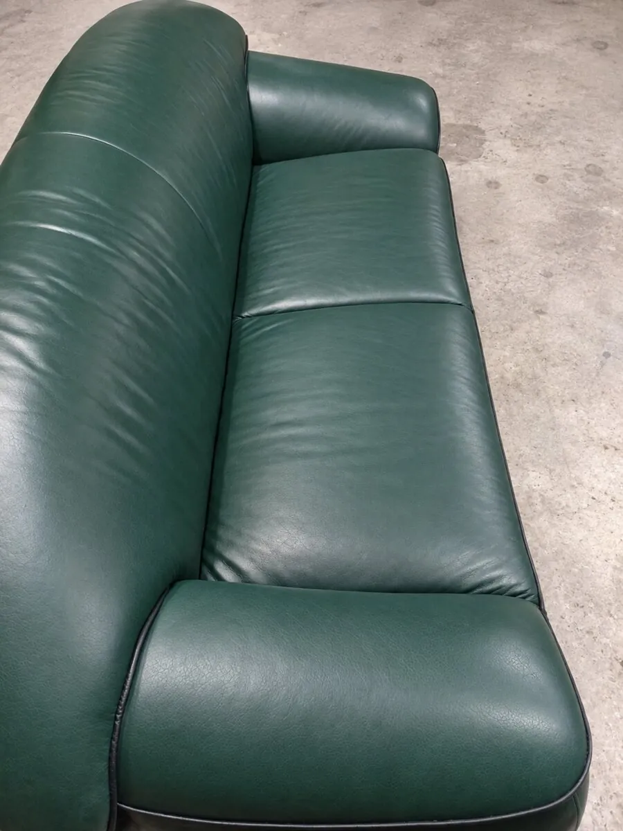 Green leather sofa after restoration